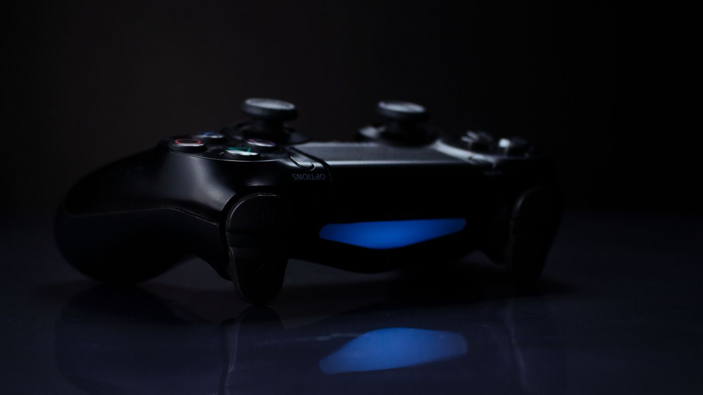 Dark gamepad under cinematic light