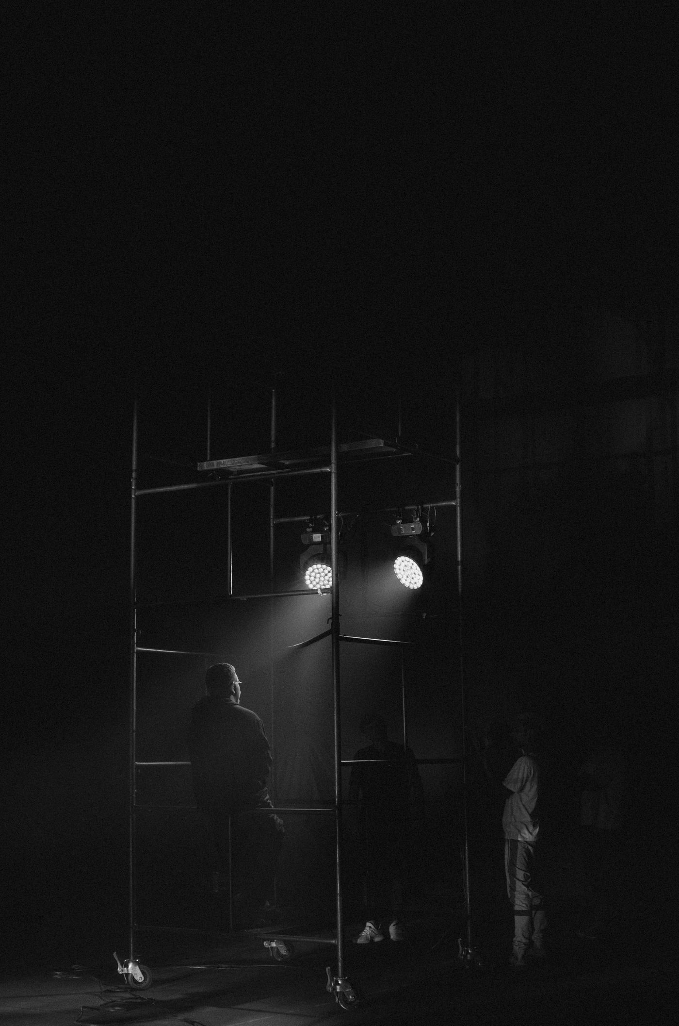 Dark stage with dramatic spotlights